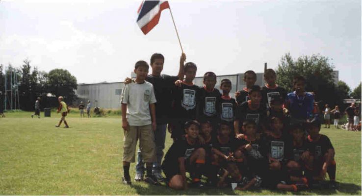 July 2002. Gothia Cup in GÃ¶teborg
with football teams from the whole world. Her is M. together with the tain team Tamrong Thai Boys 12.
